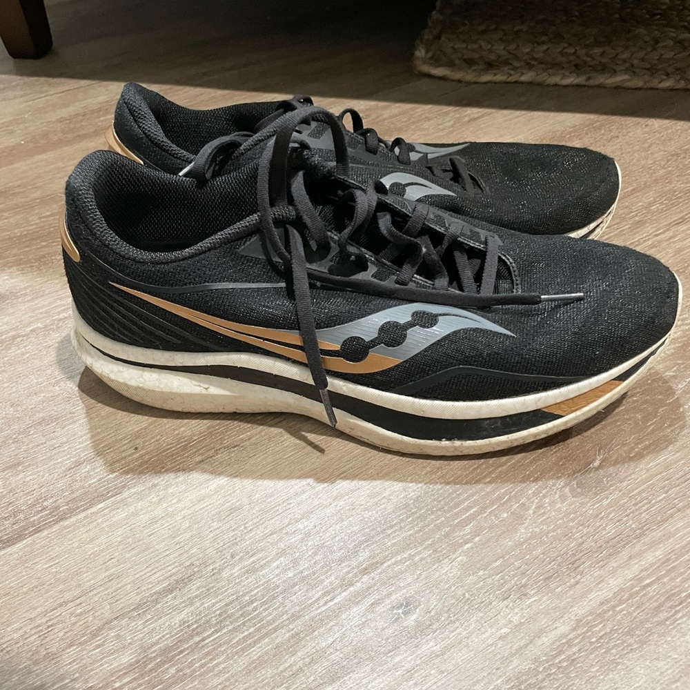 Saucony Endorphin Speeds. Black and gold.